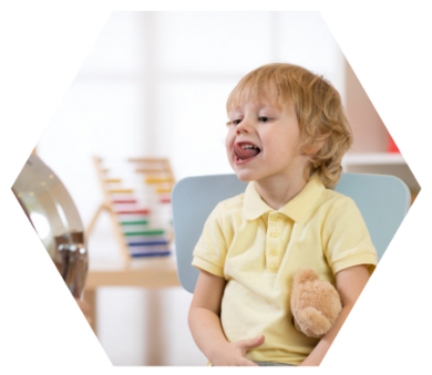 A smiling toddler playing